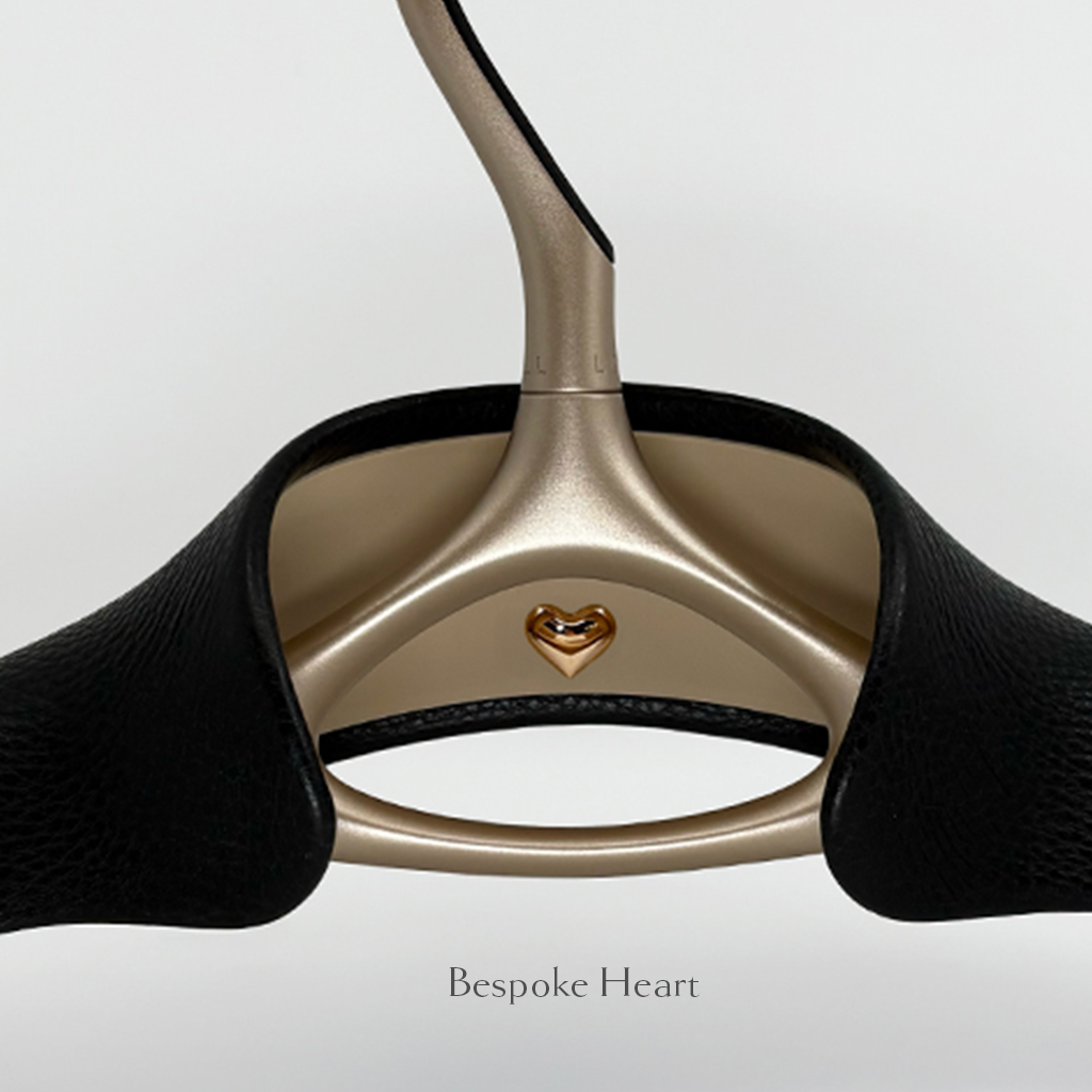 Luxury wedding dress hanger wrapped in onyx Italian leather with a bespoke heart in its center