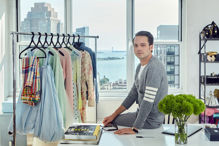 Thomas Carter Phillips, celebrity stylist, in his studio with Lou Hansell designer hangers and luxury garments.