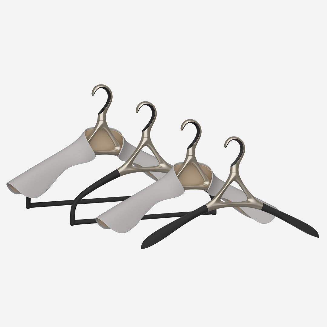 A set of four Lou Hansell H Series luxury hangers in yellow gold, including a base hanger, a jacket hanger, a trousers hanger, and a jacket and trousers hanger,