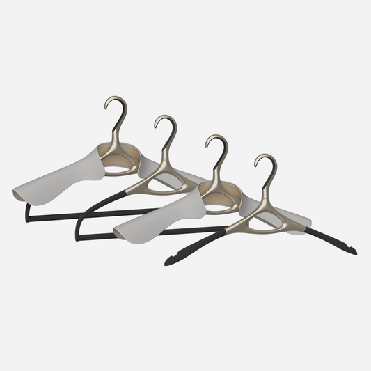 Image of Lou Hansell's L series luxury hangers set, featuring 4 different premium clothes hangers, in Yellow Gold and Off-White.