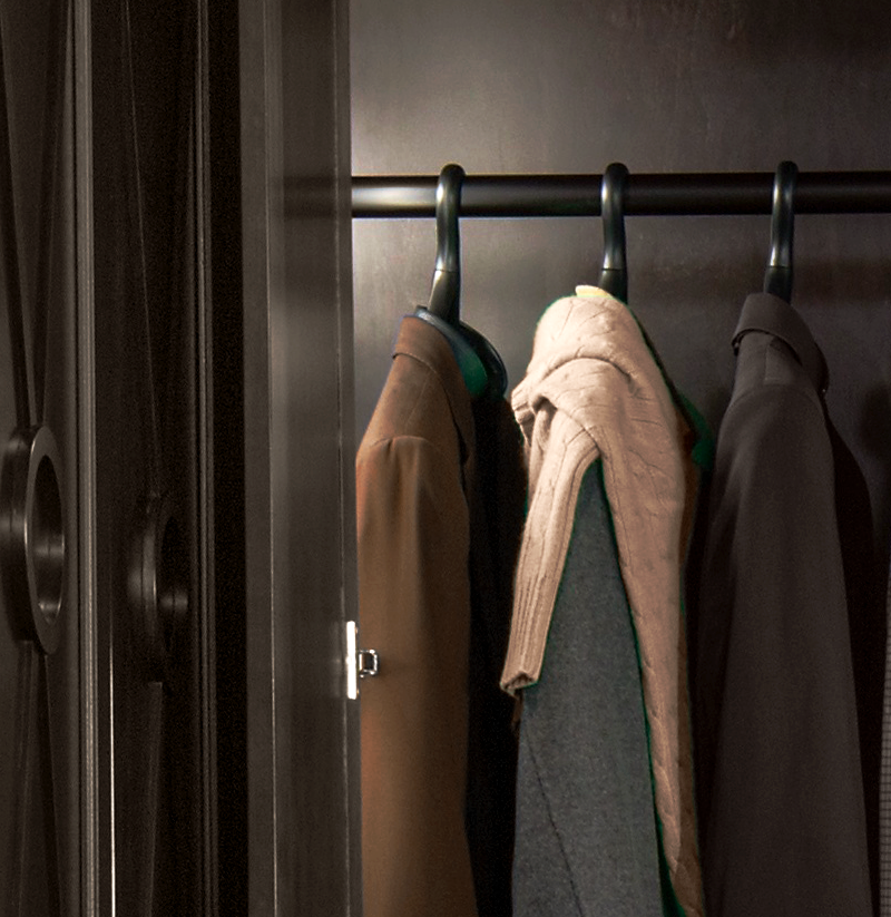 Closet with tan, grey, and brown jackets