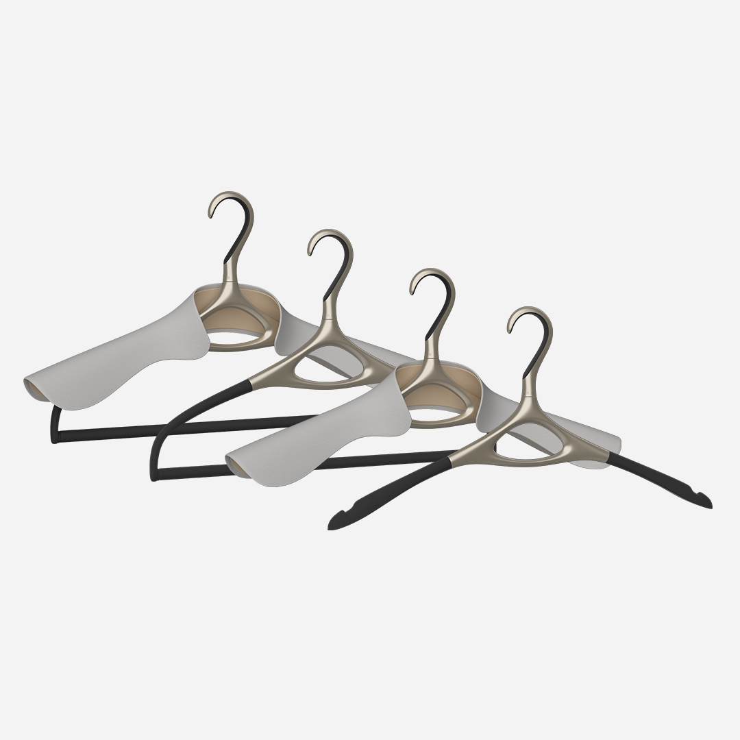 A set of four Lou Hansell L Series luxury hangers in yellow gold, including a base hanger, a jacket hanger, a trousers hanger, and a jacket and trousers hanger, 